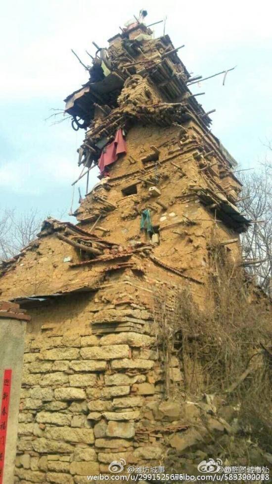 智障农民捡泥土石块建起七层小楼.jpg